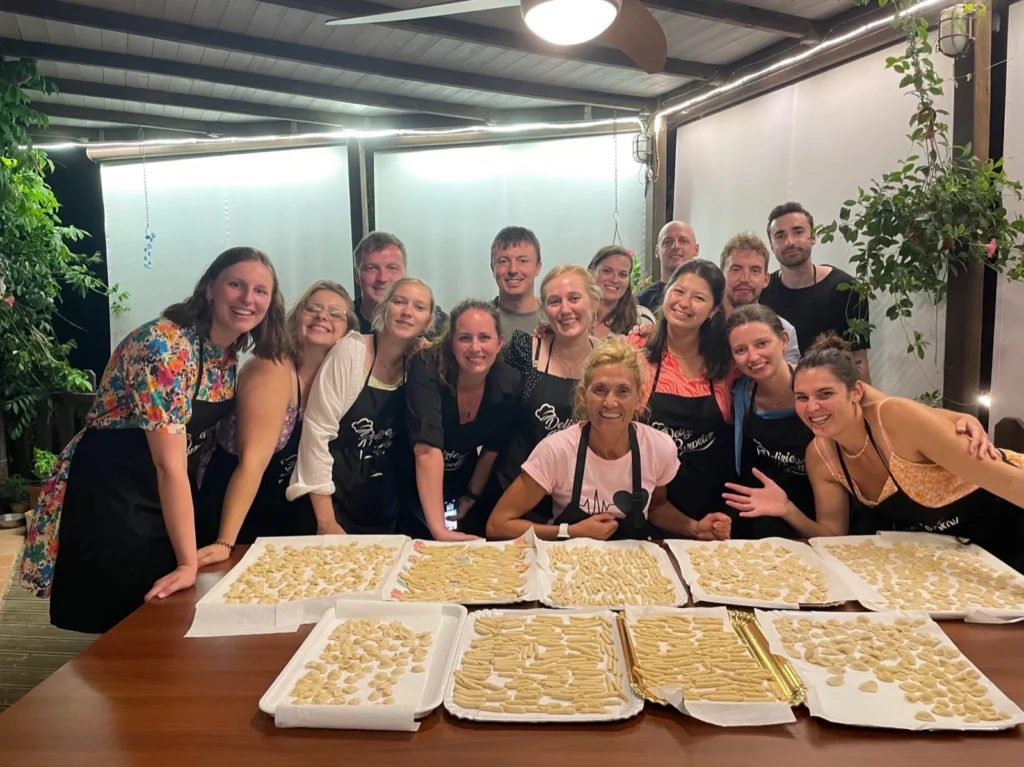 Guests smiling after making fresh pasta together