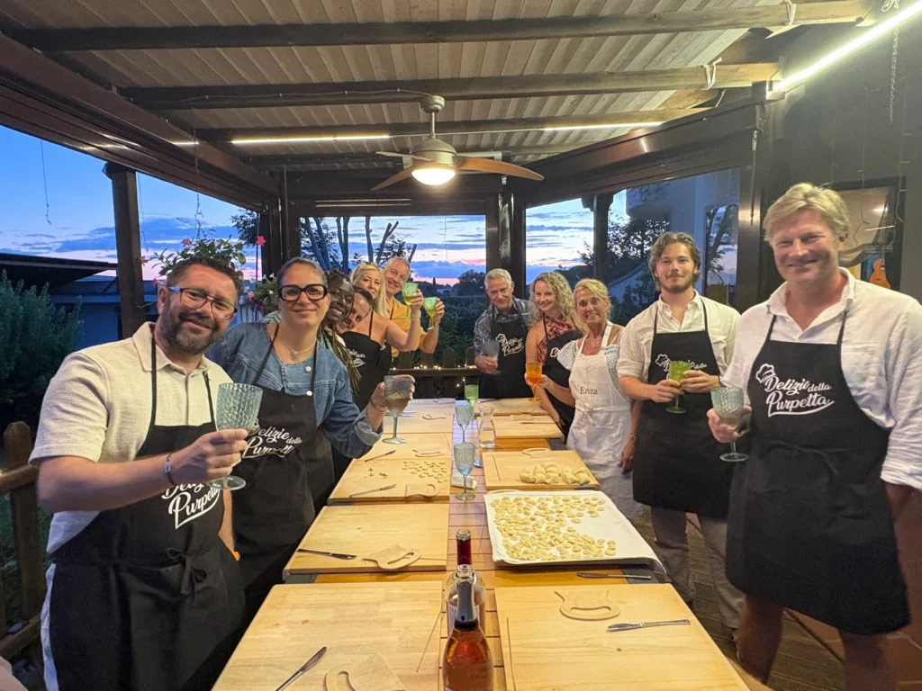 Guests smiling after making fresh pasta together