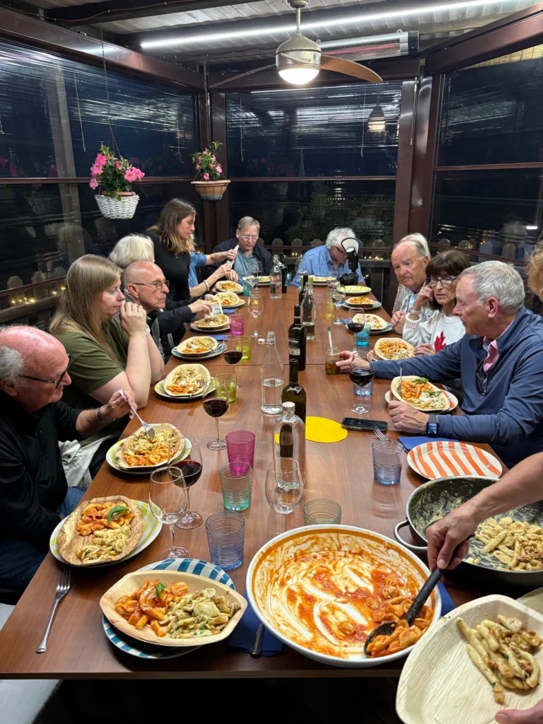 Guests enjoying dinner around the table
