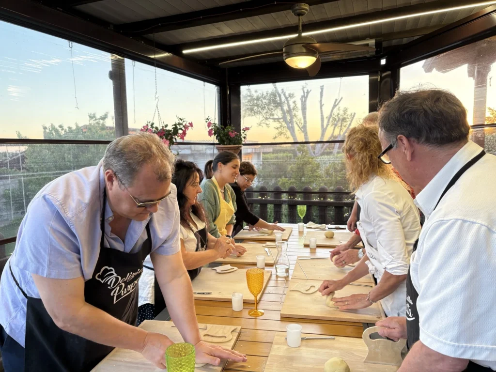 Guests making fresh pasta together