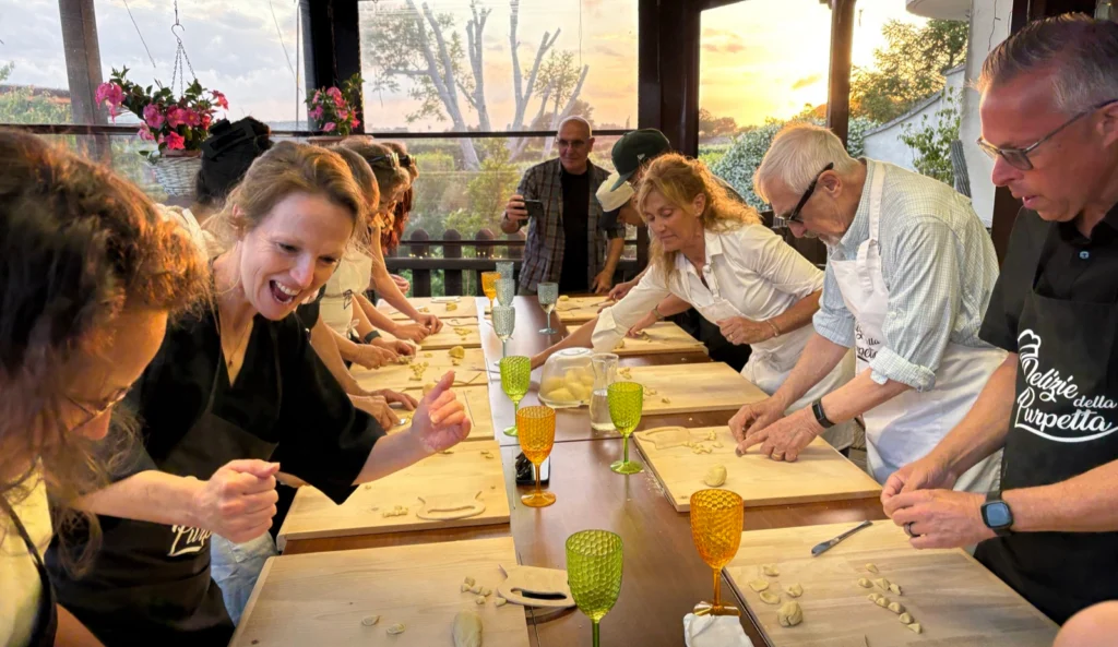 Guests making handmade pasta at our table